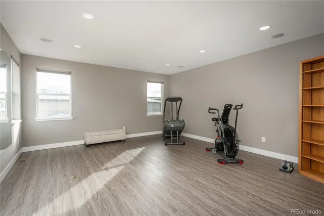 an empty room with gym equipment and a large window