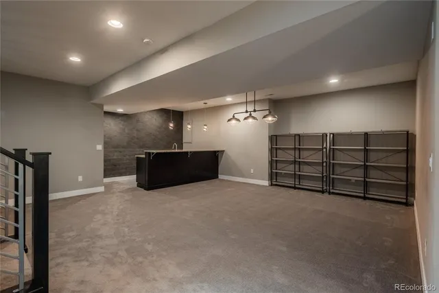 an empty room with furniture and natural light