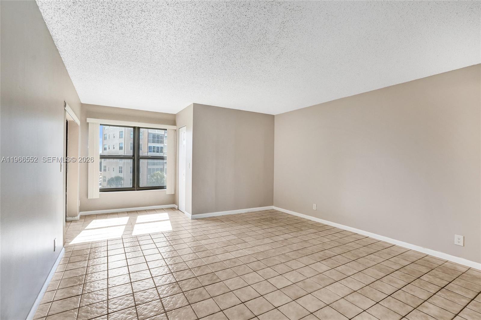 14475 Strathmore Lane, Unit 406 Delray Beach, FL 33446 - Photo 16 of 29 Sitting area, walk-in closet