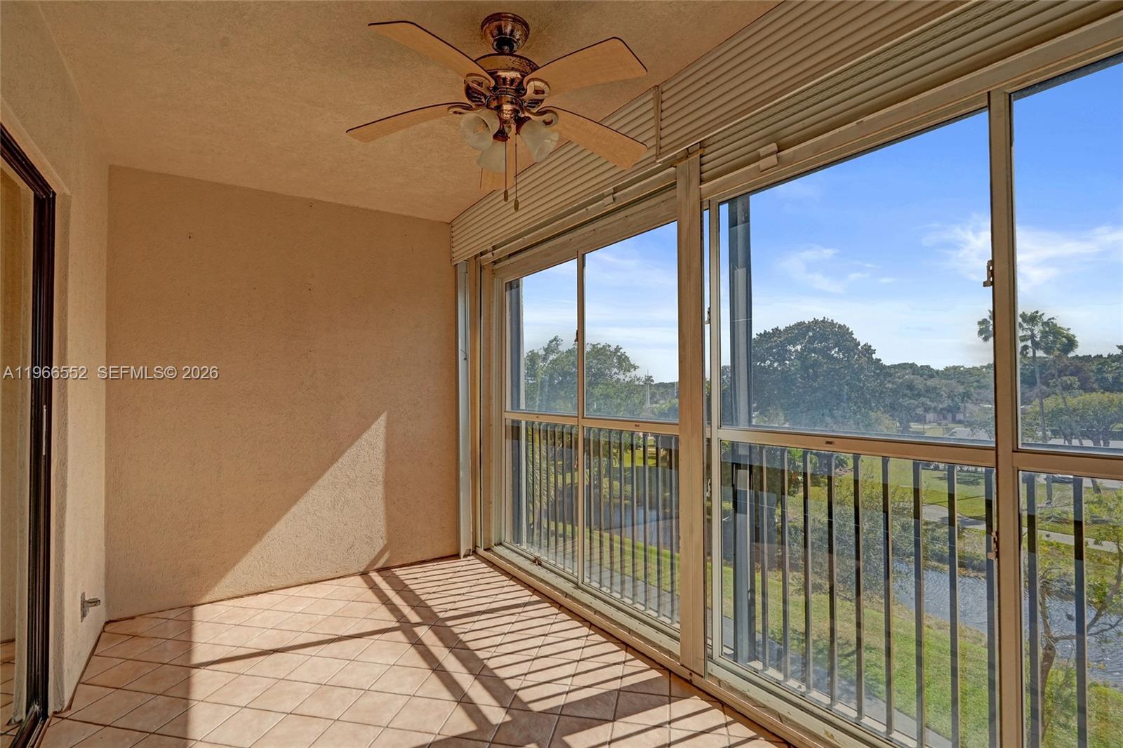 14475 Strathmore Lane, Unit 406 Delray Beach, FL 33446 - Photo 6 of 29 Glass enclosed balcony