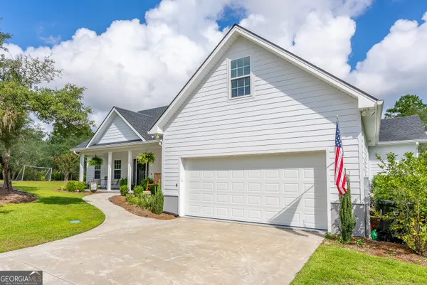a front view of a house with garden