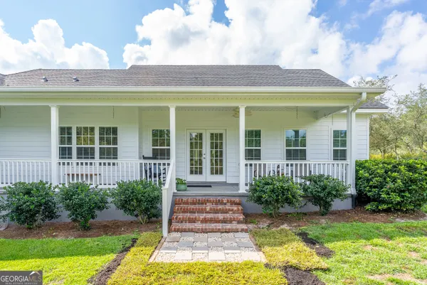 a view of a house with swimming pool