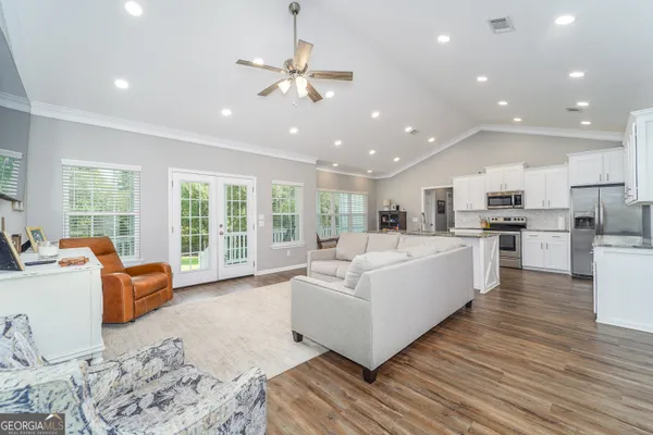 a living room with furniture and a flat screen tv