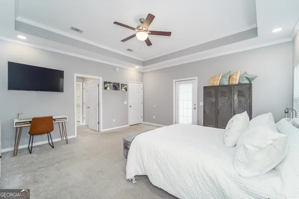 a view of walk in closet with clothes