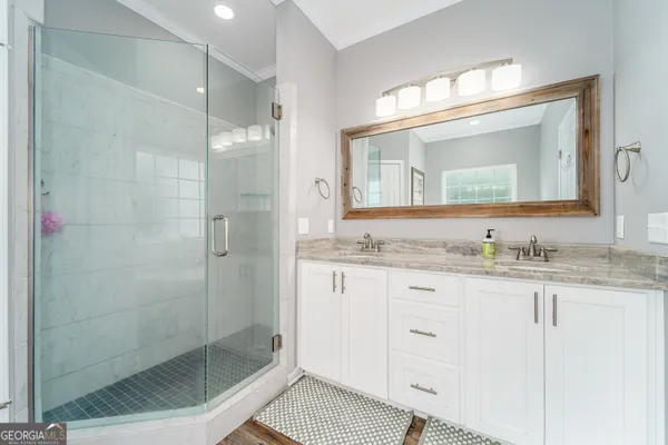 a white toilet sitting next to a bathroom sink