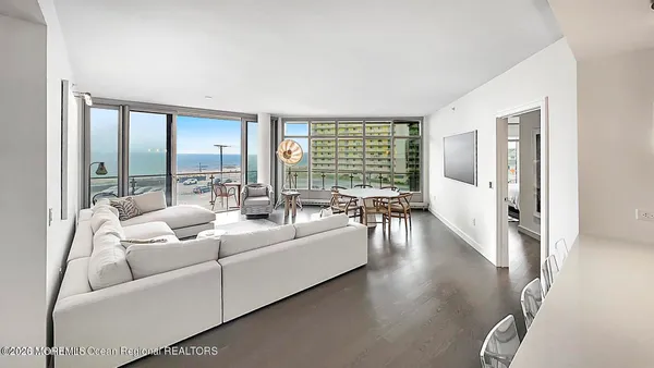 a large bed sitting in a bedroom next to a window