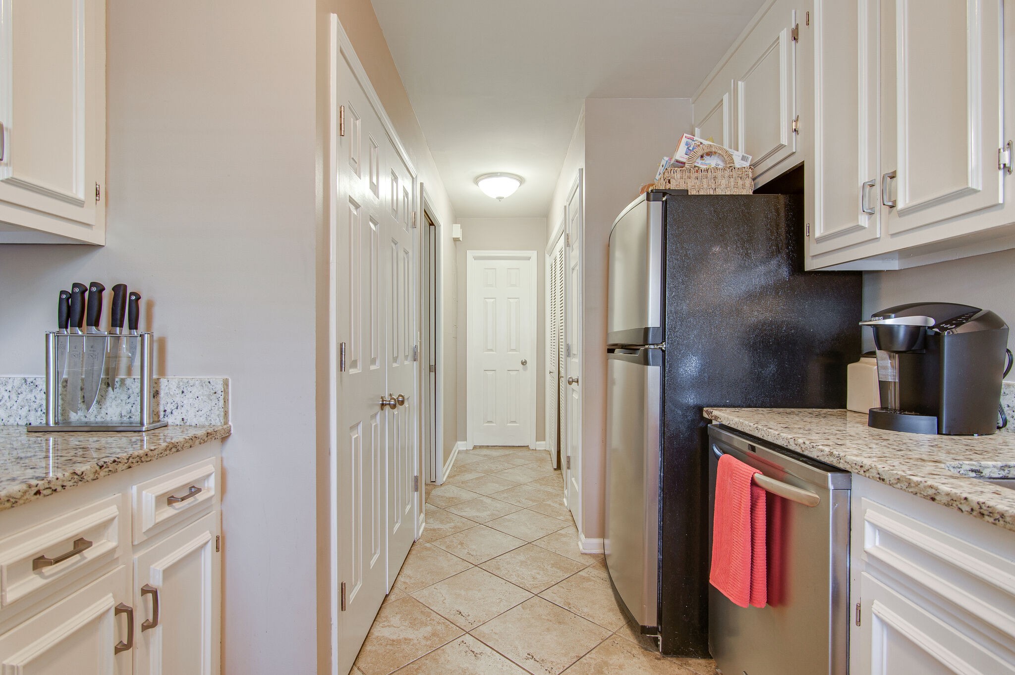 902 General George Patton Road Nashville, TN 37221 - Photo 11 of 22 a kitchen with stainless steel appliances granite countertop a refrigerator and a sink