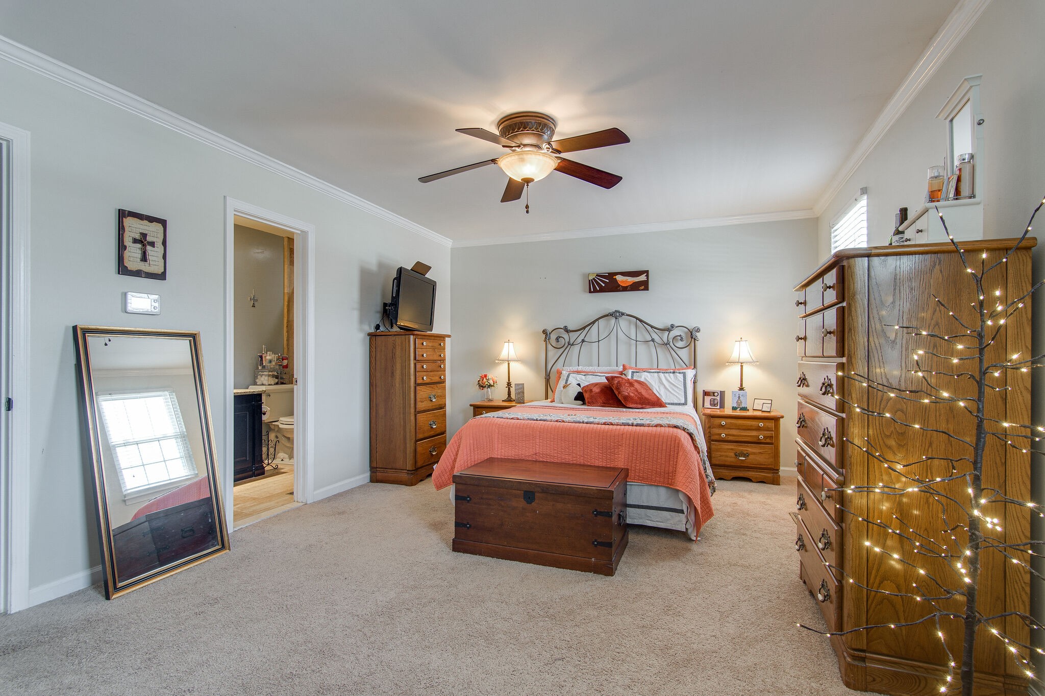 902 General George Patton Road Nashville, TN 37221 - Photo 14 of 22 a bedroom with a bed and a chandelier