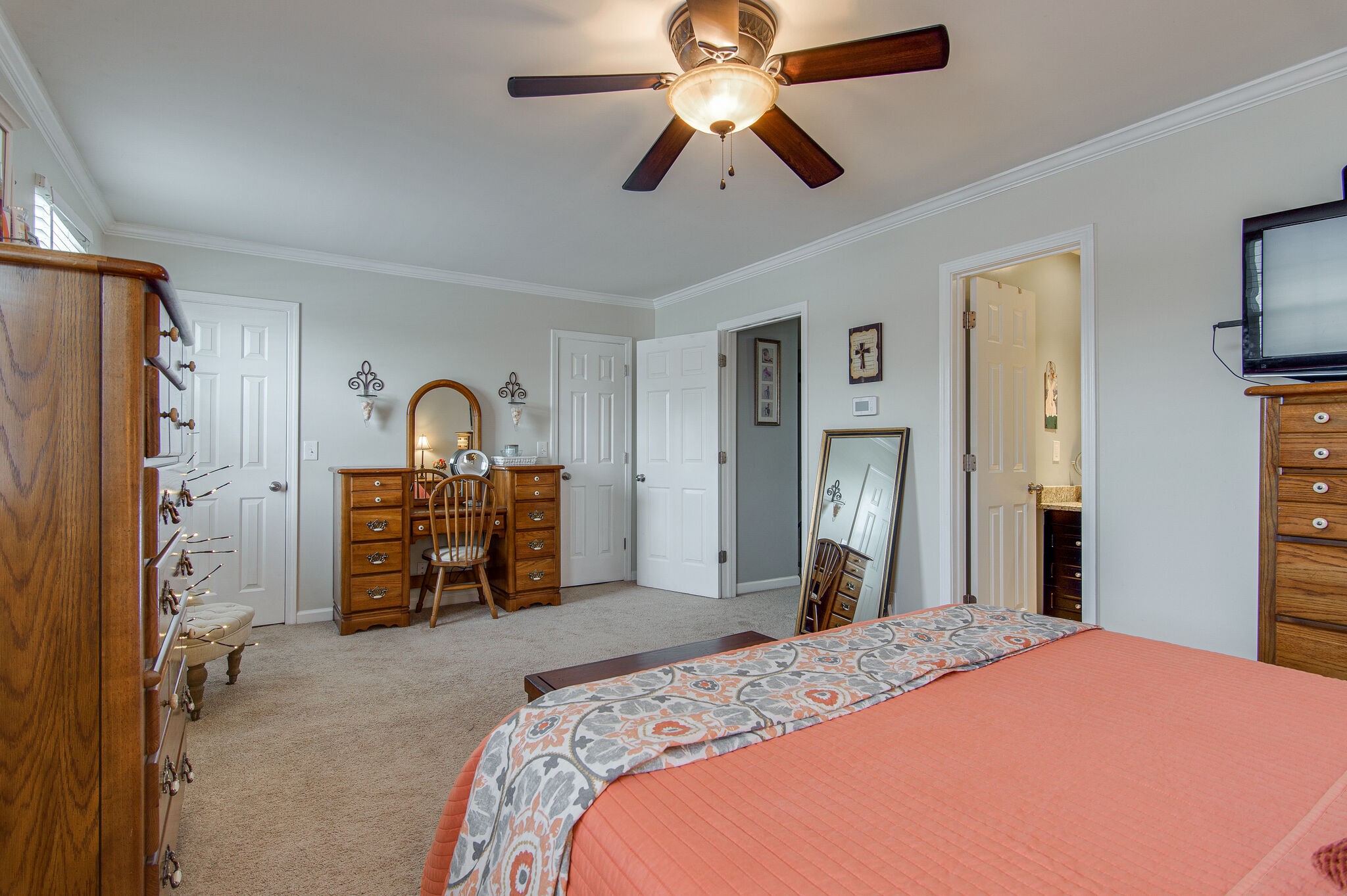 902 General George Patton Road Nashville, TN 37221 - Photo 16 of 22 a bedroom with a bed and a chandelier