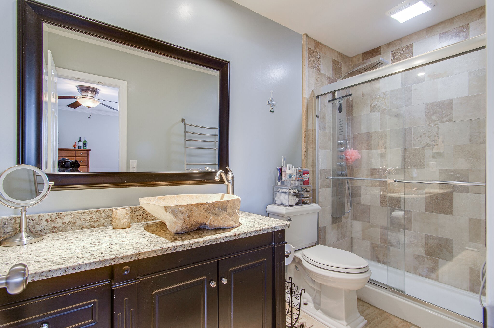 902 General George Patton Road Nashville, TN 37221 - Photo 17 of 22 a bathroom with a granite countertop sink a toilet and shower