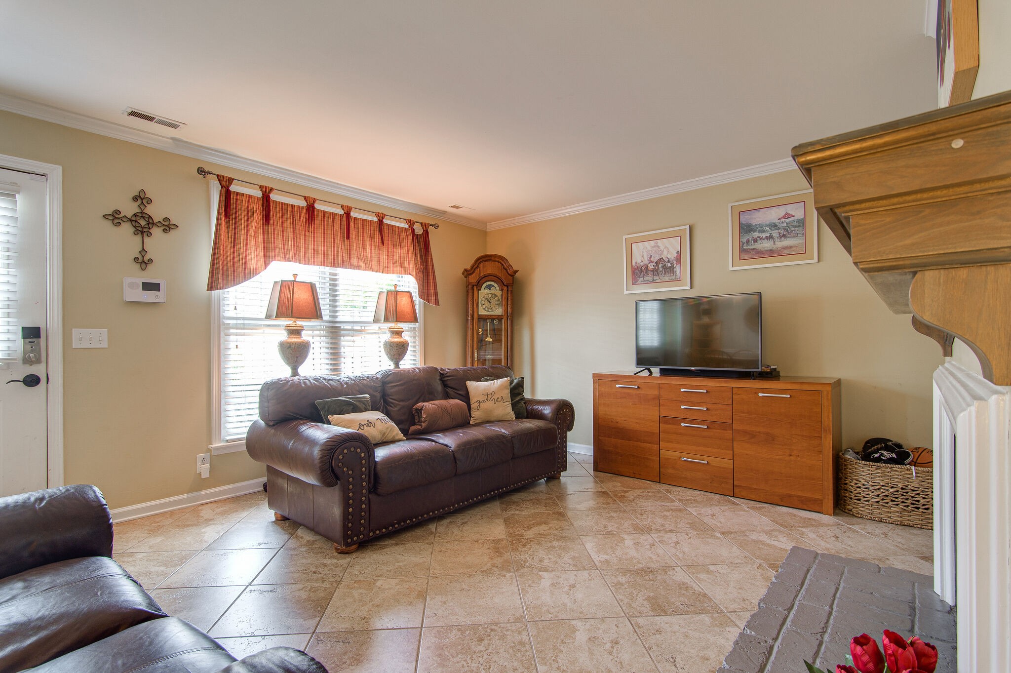 902 General George Patton Road Nashville, TN 37221 - Photo 4 of 22 a living room with furniture a flat screen tv and a window