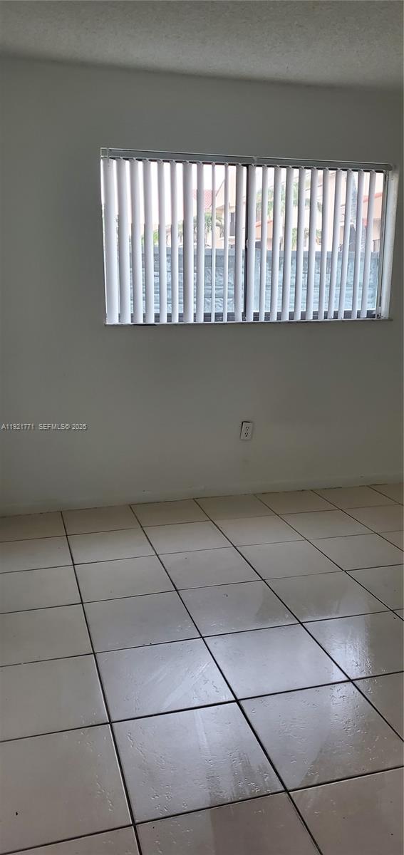 5702 West 26th Avenue, Unit 5702 Hialeah, FL 33016 - Photo 5 of 10 a view of room with windows
