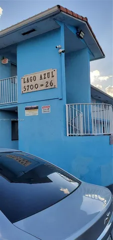 a car parked in front of a house