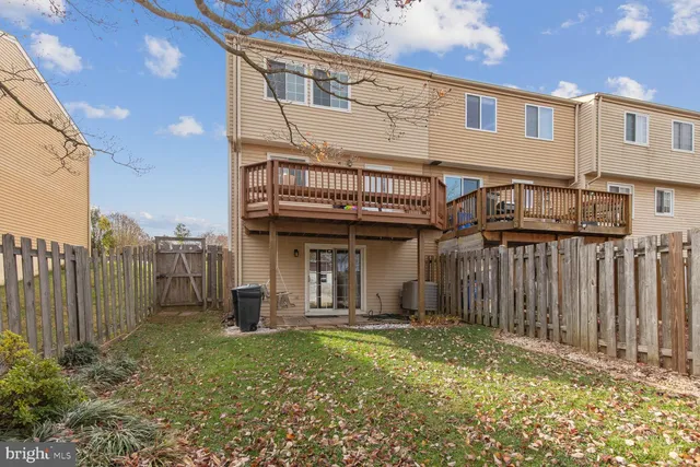 a view of a house with a backyard and stairs