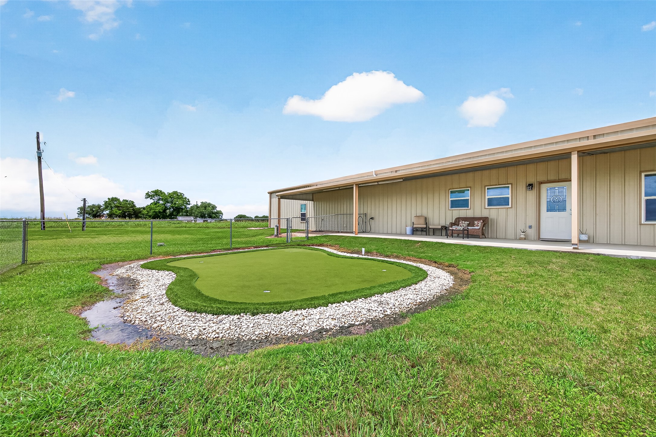 8430 Altimore Road Needville, TX 77461 - Photo 44 of 49 Back yard w/ putting green