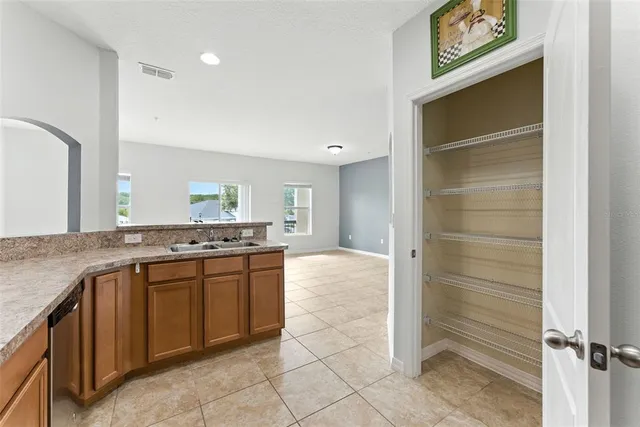 a kitchen with stainless steel appliances granite countertop a stove and a sink