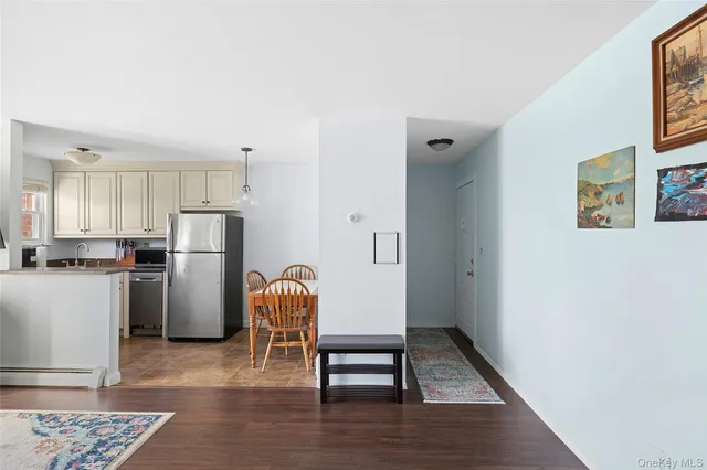 a view of kitchen with refrigerator stove and oven