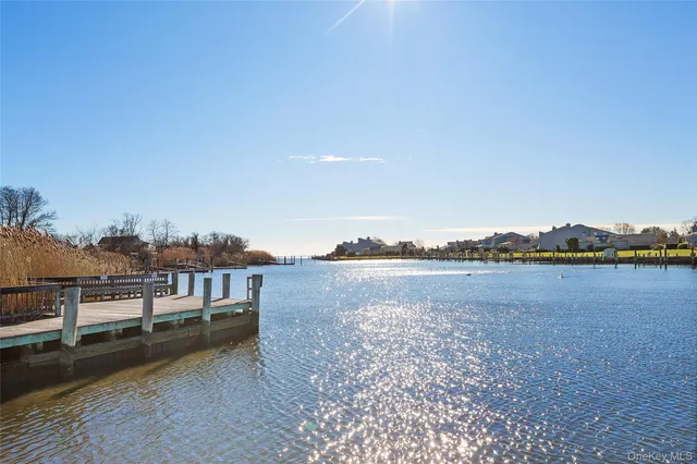a view of a lake next to a lake with houses