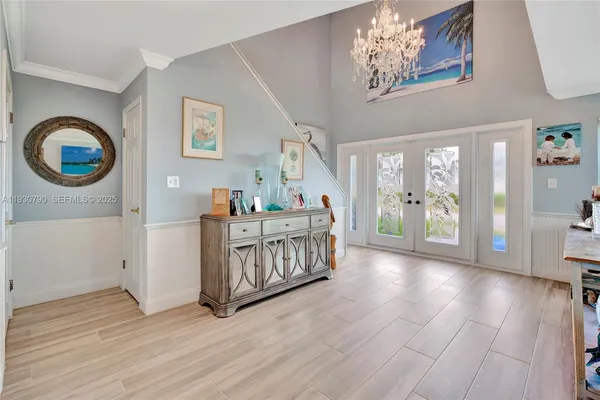 a bedroom with furniture and wooden floor