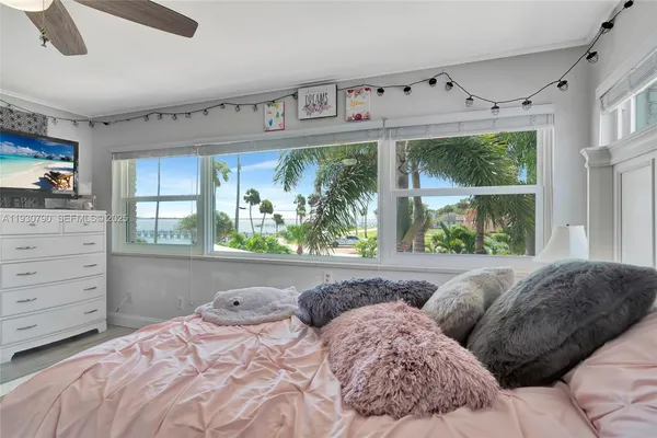 a bedroom with bed and window