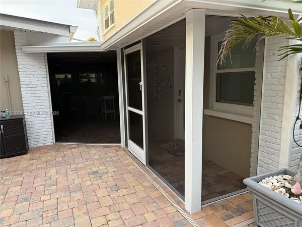 a view of a door and a window