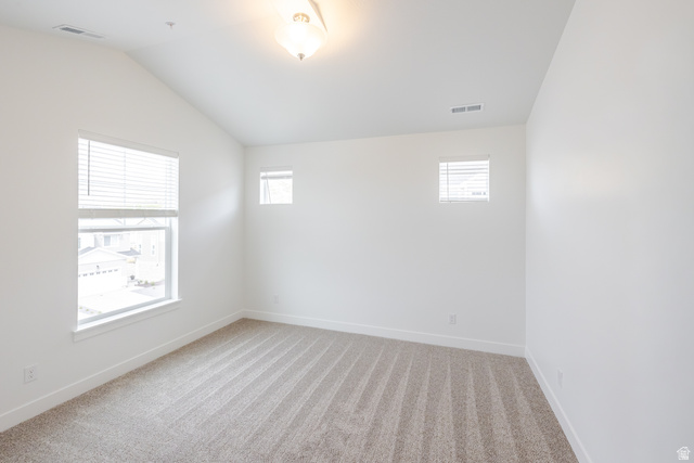 693 West 4500th South, Unit O301 Mapleton, UT 84664 - Photo 10 of 16 Unfurnished room with light colored carpet and lofted ceiling