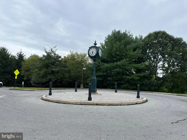 a swimming pool with trees in the background