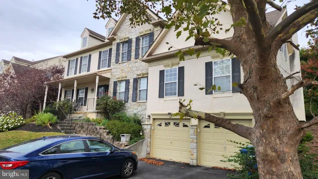 a front view of a house with parking space