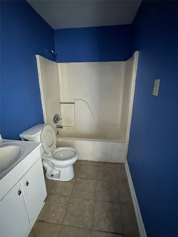 a view of an empty room and a window