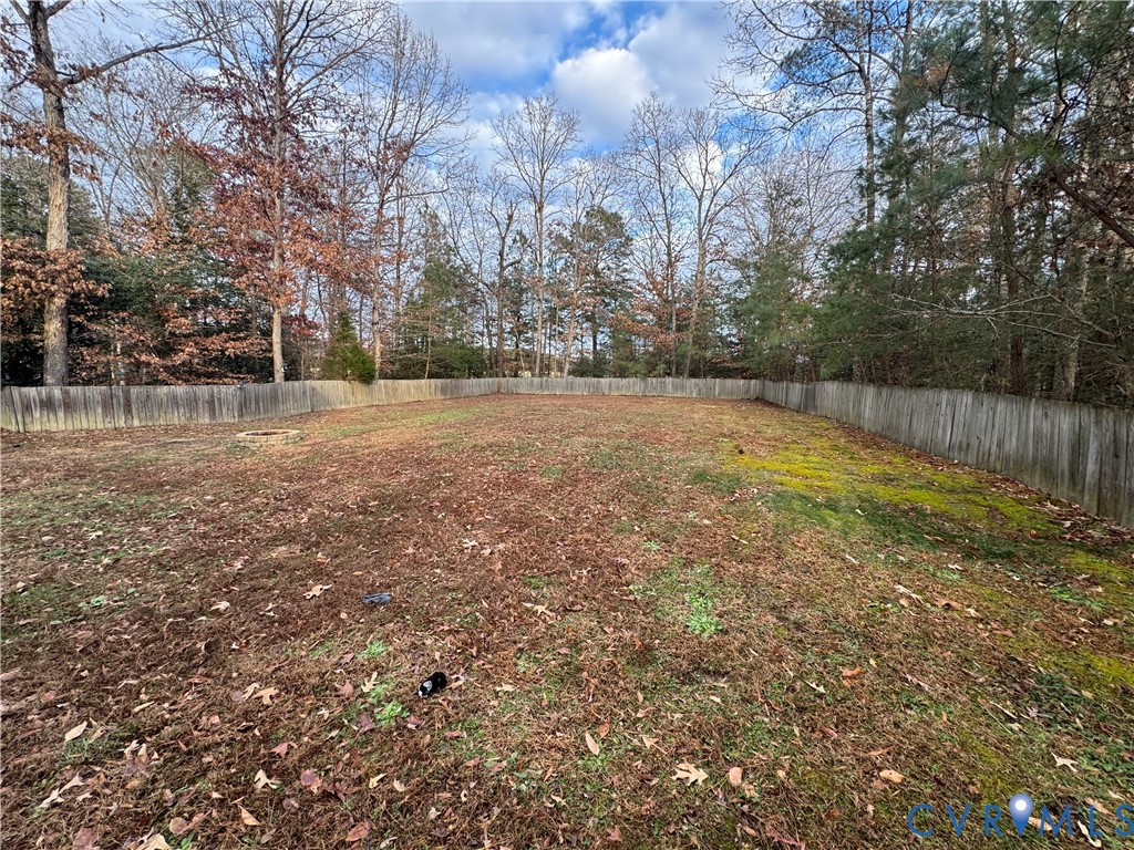 211 Pine Ridge Road Aylett, VA 23009 - Photo 6 of 11 a view of a big yard with trees