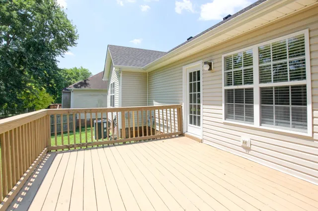 a view of a balcony with wooden floor