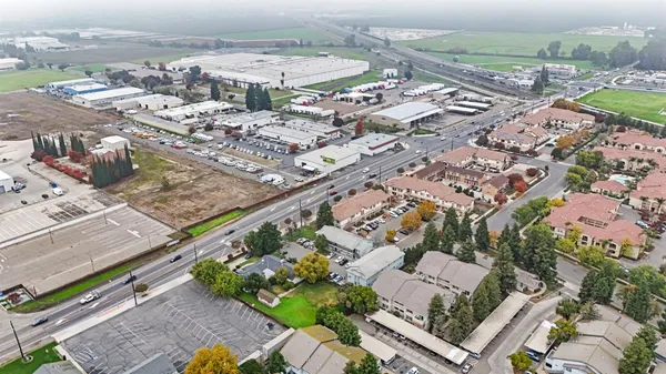 an aerial view of residential houses with outdoor space