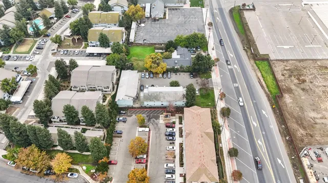 an aerial view of houses with outdoor space