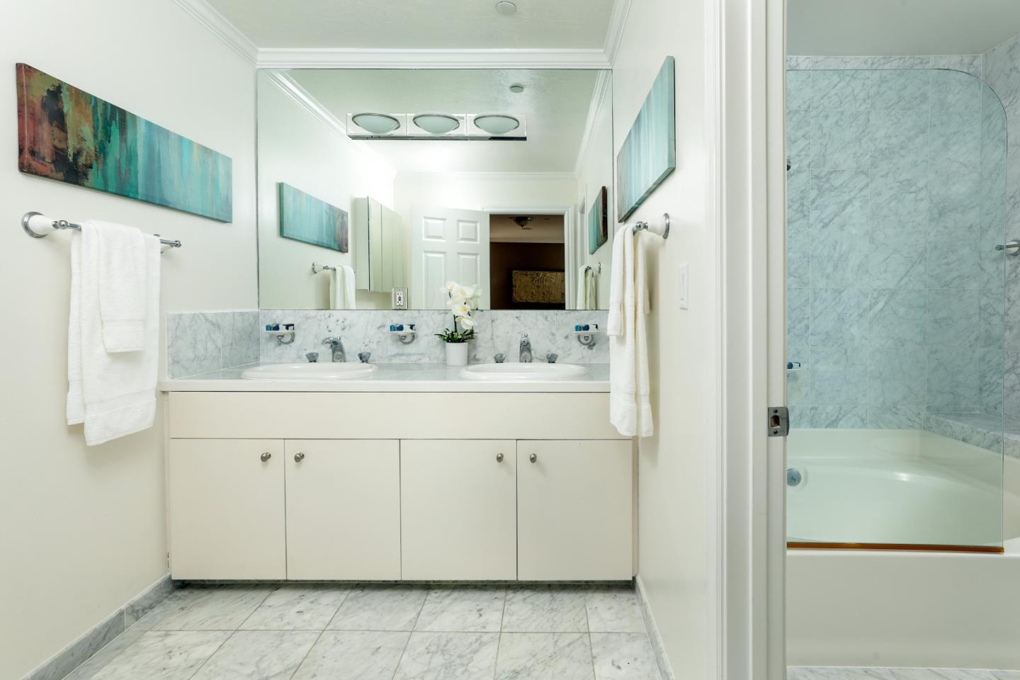 1314 Cloud Avenue Menlo Park, CA 94025 - Photo 14 of 31 a bathroom with a sink a mirror and a shower