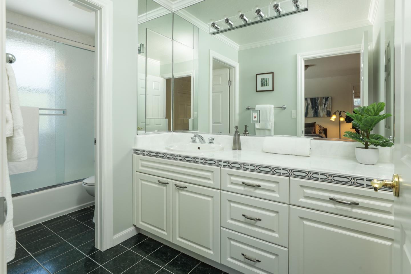 1314 Cloud Avenue Menlo Park, CA 94025 - Photo 22 of 31 a bathroom with a granite countertop sink and a mirror