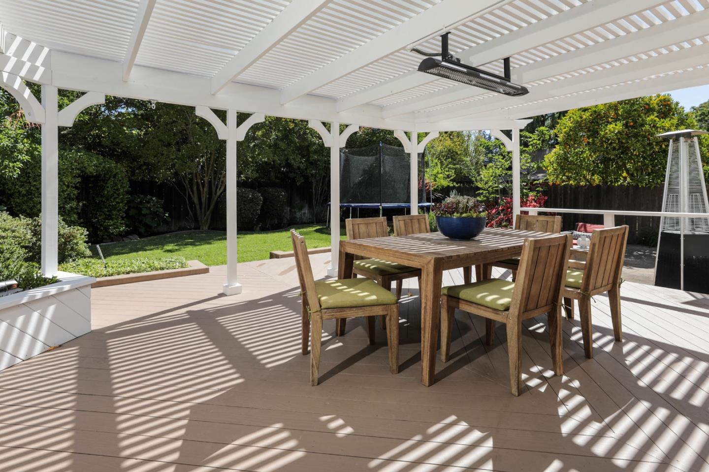 1314 Cloud Avenue Menlo Park, CA 94025 - Photo 24 of 31 a view of a patio with a dining table and chairs