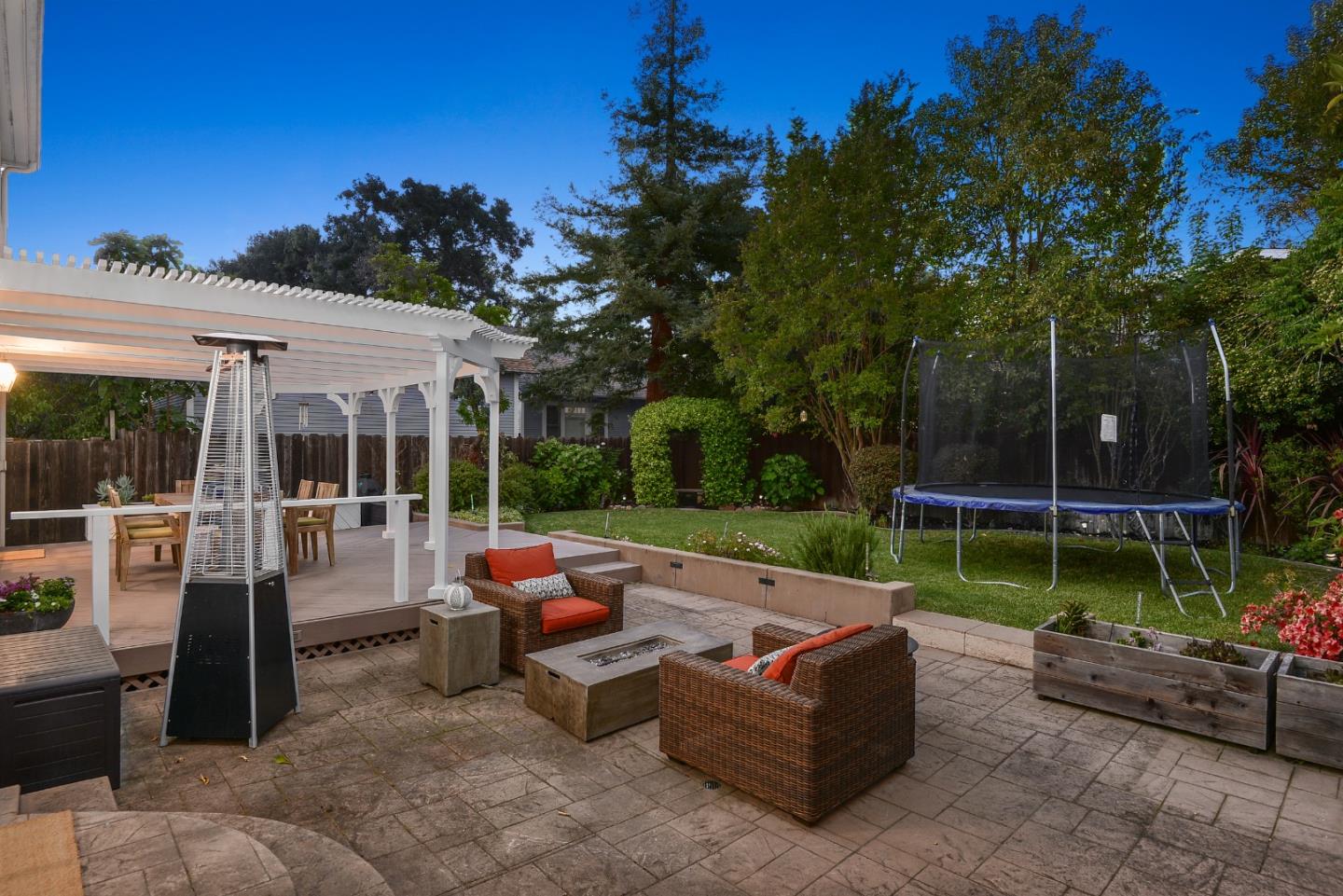 1314 Cloud Avenue Menlo Park, CA 94025 - Photo 26 of 31 a backyard of a house with fountain table and chairs