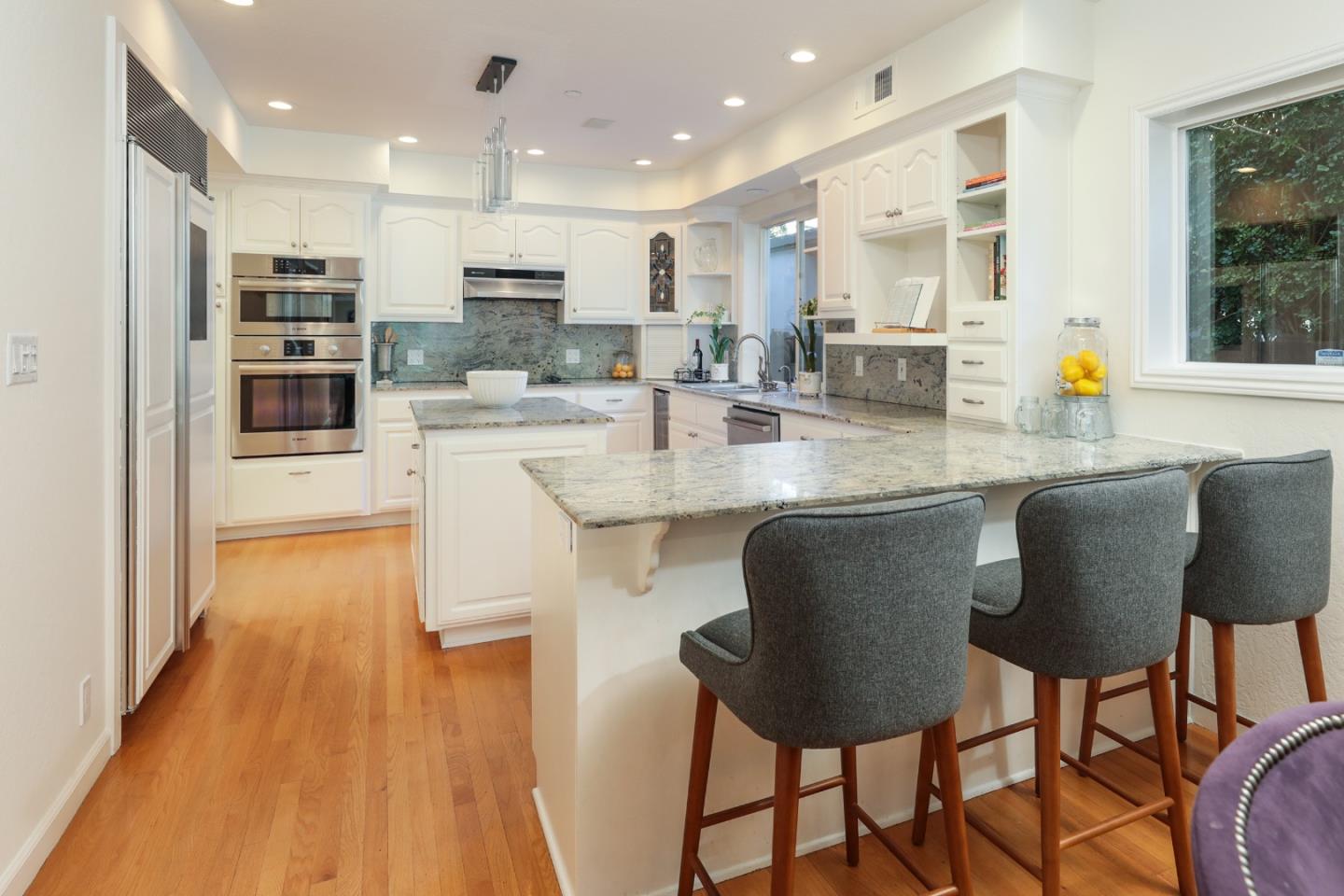 1314 Cloud Avenue Menlo Park, CA 94025 - Photo 10 of 31 a kitchen with stainless steel appliances granite countertop a stove top oven a sink island and a refrigerator