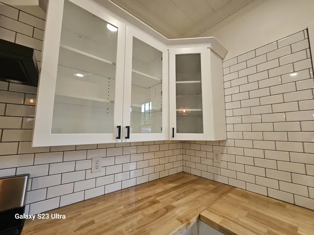 a bathroom with a bathtub and a window
