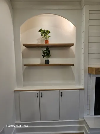a view of small living room with hallway