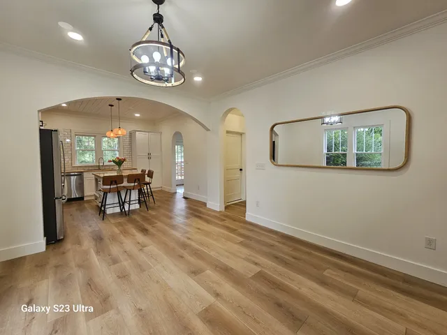 a view of a livingroom with furniture and a chandelier