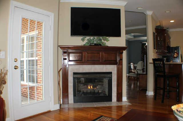 128 Hunters Ridge Drive Tullahoma, TN 37388 - Photo 11 of 20 The Hearth Room features this Charming Gas Fireplace, that is see-through to the Living Room Fireplace. Two-in-one!