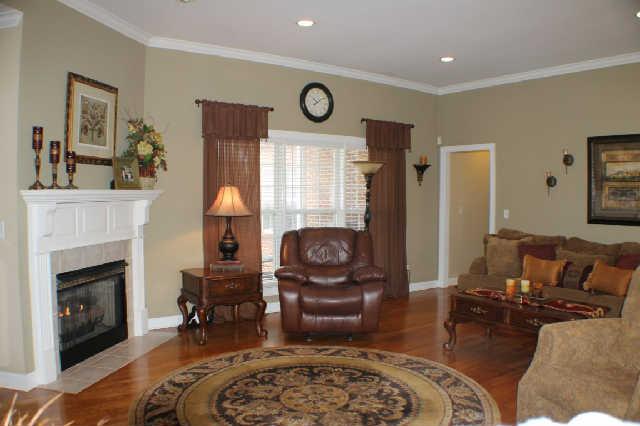 128 Hunters Ridge Drive Tullahoma, TN 37388 - Photo 4 of 20 The Living Room offers stunning hardwood floors and can lights with access to the Master Bedroom Hallway.