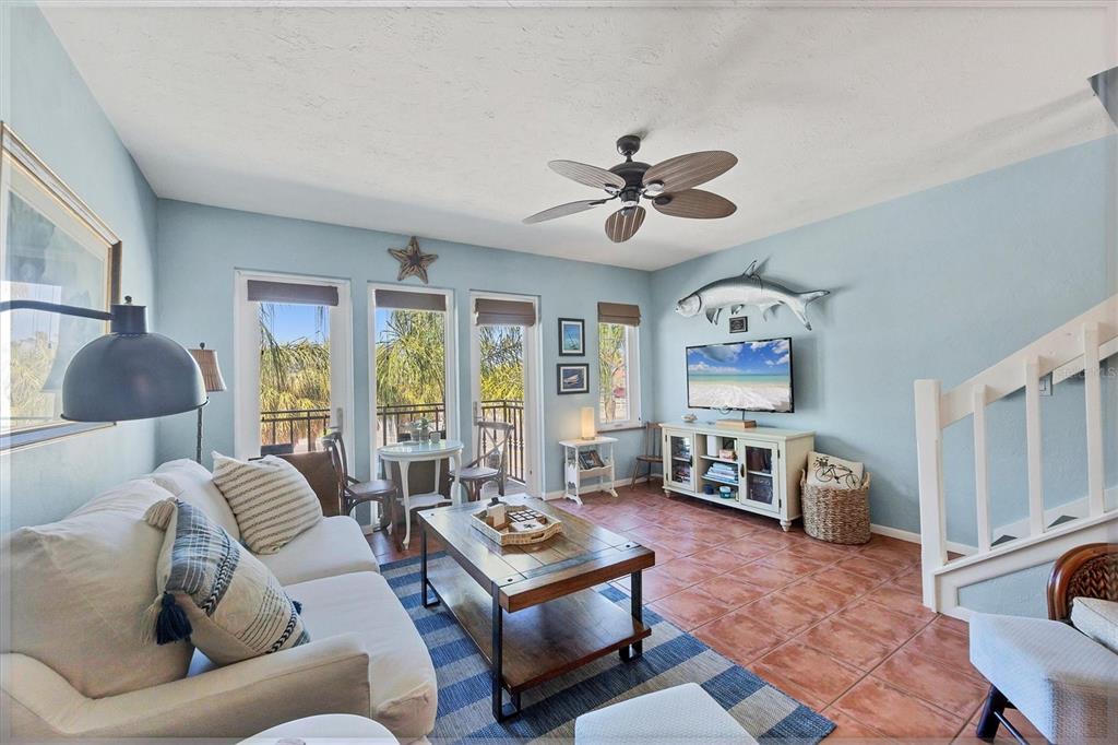 530 5th Street West, Unit 4 Boca Grande, FL 33921 - Photo 14 of 48 a living room with furniture and a flat screen tv
