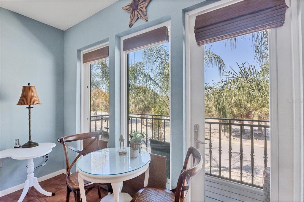 530 5th Street West, Unit 4 Boca Grande, FL 33921 - Photo 15 of 48 a dining room with furniture a chandelier and wooden floor