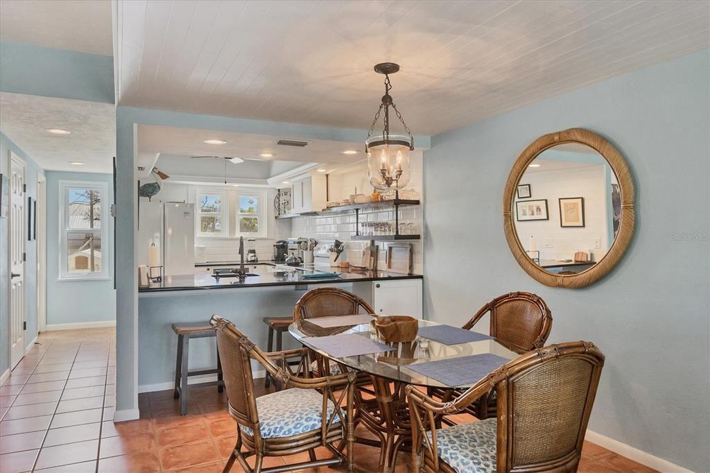 530 5th Street West, Unit 4 Boca Grande, FL 33921 - Photo 21 of 48 a dining room with a table and chairs