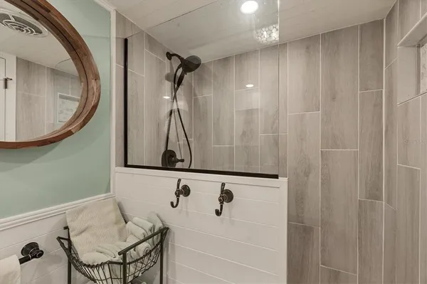 a bedroom with a bed and a chair