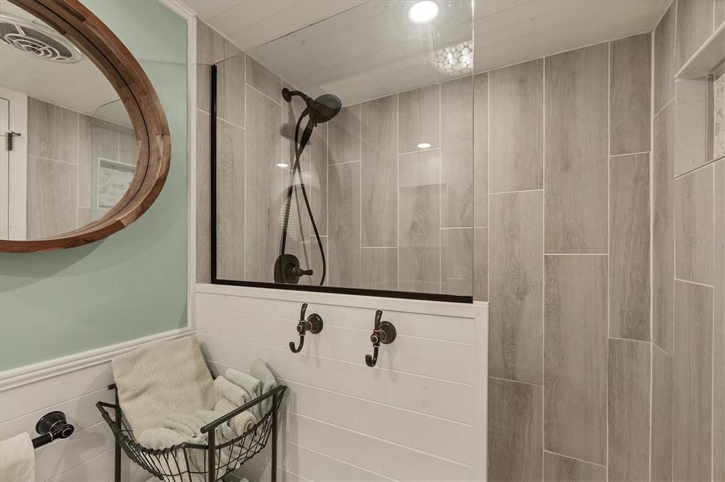 530 5th Street West, Unit 4 Boca Grande, FL 33921 - Photo 30 of 48 a bathroom with a bathtub a sink and a mirror