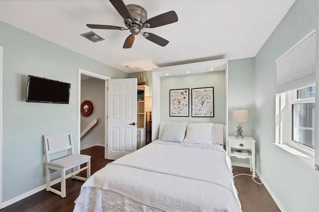 a bathroom with a granite countertop sink mirror vanity and toilet