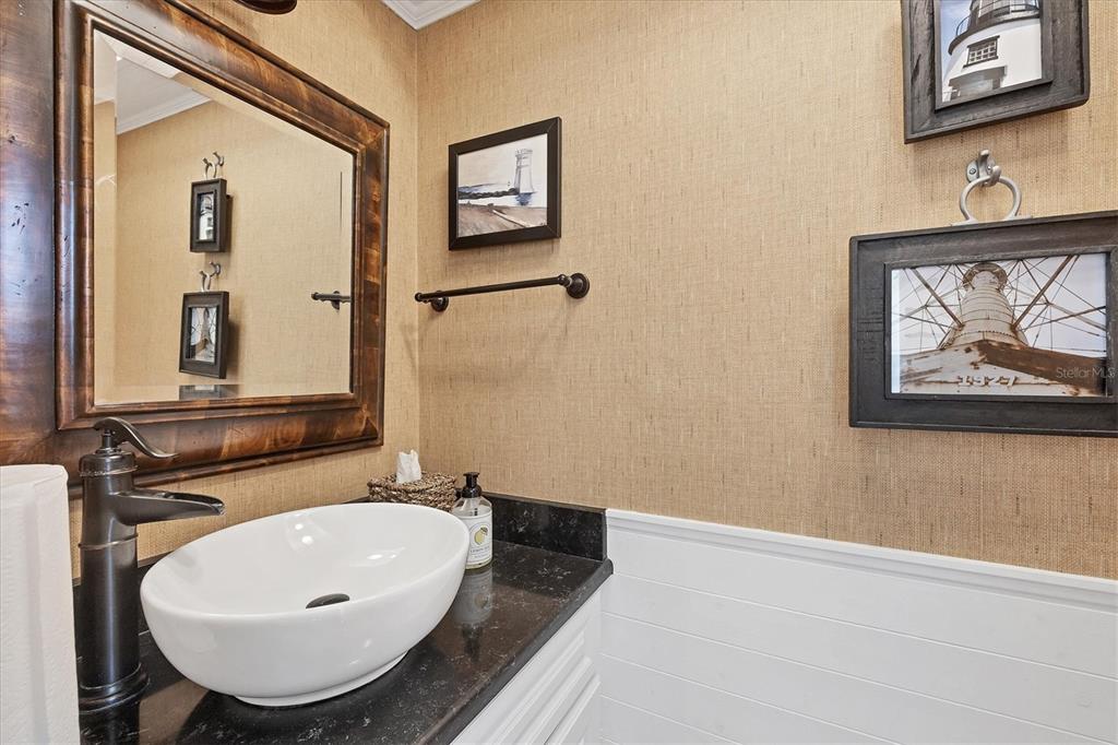 530 5th Street West, Unit 4 Boca Grande, FL 33921 - Photo 35 of 48 a bathroom with a sink and a mirror